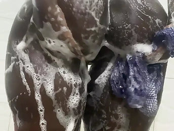 Brief-haired Nigerian hottie gets drenching humid with pleasure in a red-hot bathroom