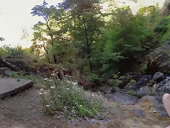 Naked dame outdoors masturbates fingering her shaved vagina